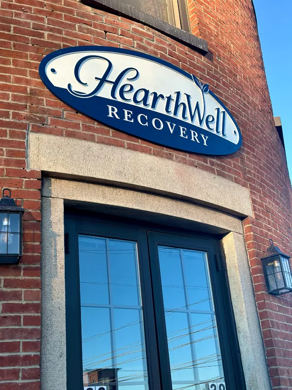 HearthWell Recovery treatment center building exterior with signage in Dover, NH